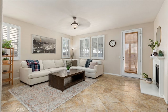 30355 Lamplighter Ln, Menifee, CA 92584 - living room featuring a fireplace with raised hearth and baseboards