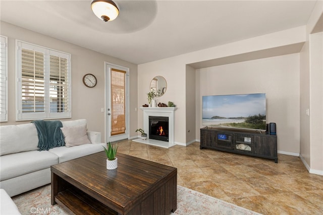 30355 Lamplighter Ln, Menifee, CA 92584 - living room with baseboards and a lit fireplace