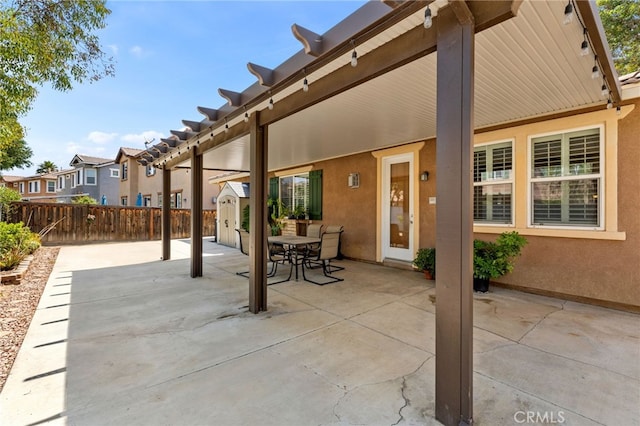 30355 Lamplighter Ln, Menifee, CA 92584 - view of patio / terrace featuring a shed, outdoor dining area, and a residential view