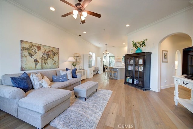 1910 Fixlini St, San Luis Obispo, CA 93401 - living area with arched walkways, ceiling fan, recessed lighting, light wood-type flooring, and crown molding