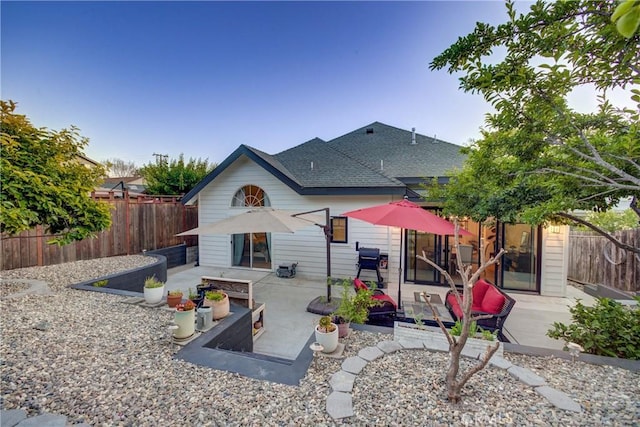 1910 Fixlini St, San Luis Obispo, CA 93401 - rear view of house with a shingled roof, a patio, and a fenced backyard