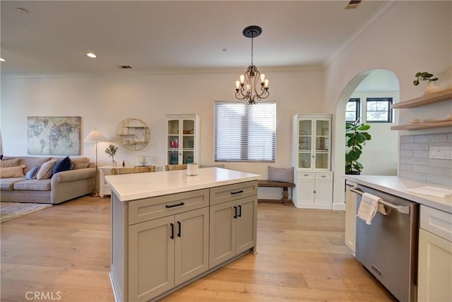 1910 Fixlini St, San Luis Obispo, CA 93401 - kitchen featuring stainless steel dishwasher, light countertops, a chandelier, open shelves, and light wood finished floors