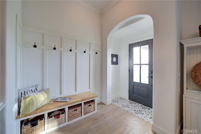 1910 Fixlini St, San Luis Obispo, CA 93401 - mudroom with arched walkways, light wood finished floors, and ornamental molding