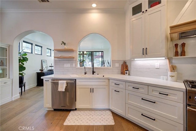 1910 Fixlini St, San Luis Obispo, CA 93401 - kitchen with appliances with stainless steel finishes, open shelves, arched walkways, light countertops, and ornamental molding