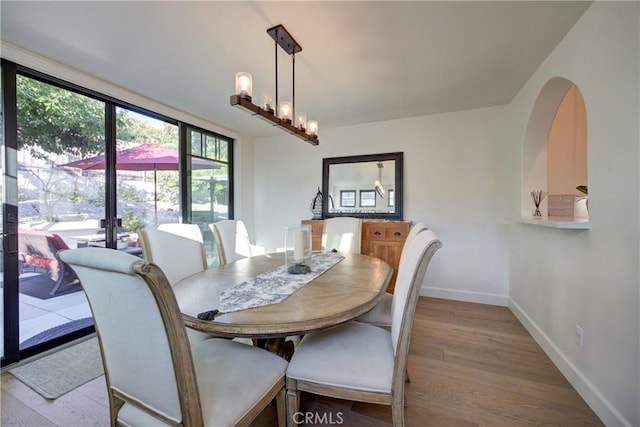 1910 Fixlini St, San Luis Obispo, CA 93401 - dining space featuring light wood finished floors and a chandelier