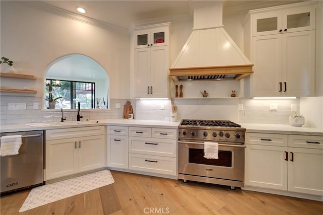 1910 Fixlini St, San Luis Obispo, CA 93401 - kitchen with appliances with stainless steel finishes, custom exhaust hood, open shelves, ornamental molding, and white cabinets