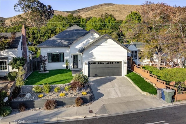1910 Fixlini St, San Luis Obispo, CA 93401 - view of front facade with a mountain view, a garage, and driveway