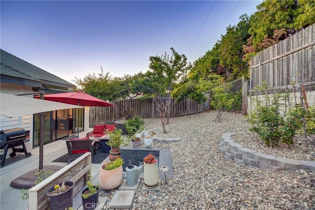 1910 Fixlini St, San Luis Obispo, CA 93401 - fenced backyard with an outdoor living space and a patio