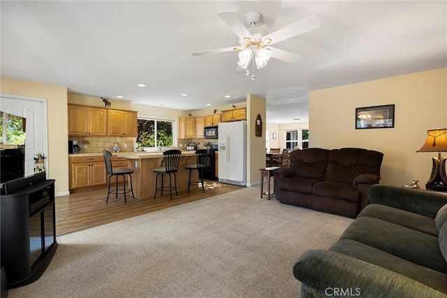438 Watson Rd, Chester, CA 96020 - living room featuring light colored carpet, a ceiling fan, recessed lighting, and light wood finished floors