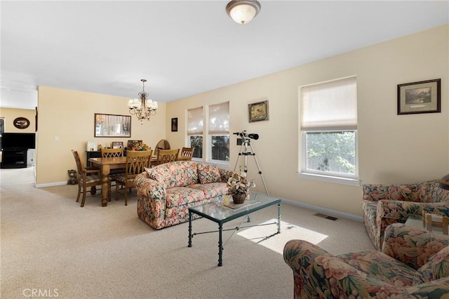 438 Watson Rd, Chester, CA 96020 - carpeted living room featuring a chandelier and baseboards