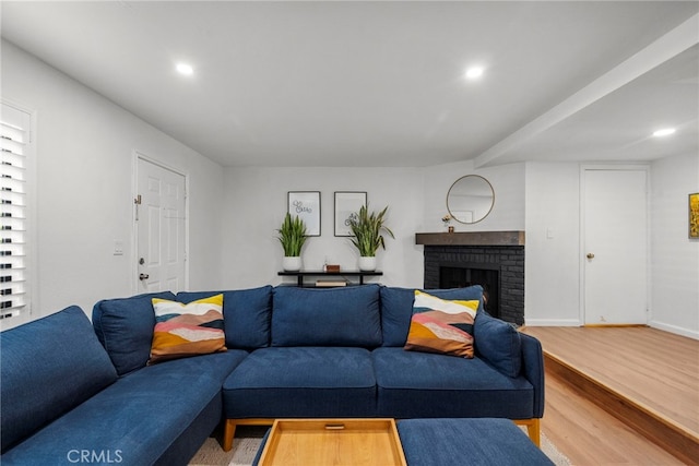 15230 Roxford St Unit 61, Sylmar, CA 91342 - living room with wood finished floors, a fireplace, and recessed lighting