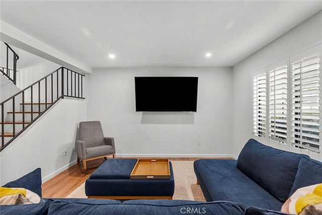 15230 Roxford St Unit 61, Sylmar, CA 91342 - living room featuring wood finished floors, stairway, and recessed lighting