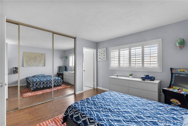 15230 Roxford St Unit 61, Sylmar, CA 91342 - bedroom with wood finished floors and a closet