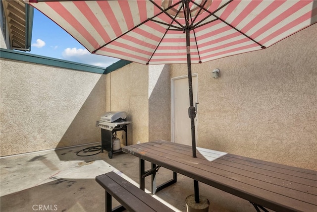 15230 Roxford St Unit 61, Sylmar, CA 91342 - view of patio with a grill and outdoor dining area