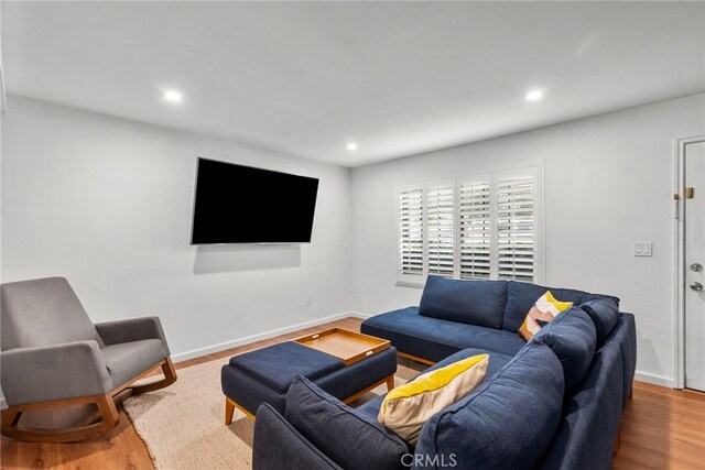 15230 Roxford St Unit 61, Sylmar, CA 91342 - living room featuring recessed lighting and wood finished floors