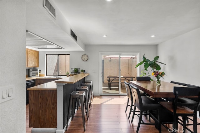 15230 Roxford St Unit 61, Sylmar, CA 91342 - dining room with wood finished floors and recessed lighting
