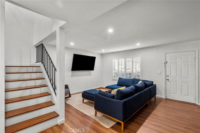15230 Roxford St Unit 61, Sylmar, CA 91342 - living room featuring wood finished floors, stairway, and recessed lighting