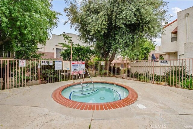 12411 Osborne St Unit 114, Pacoima, CA 91331 - view of swimming pool featuring a hot tub