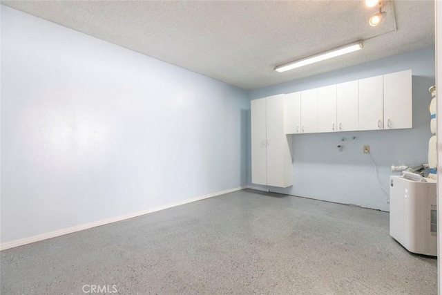 12411 Osborne St Unit 114, Pacoima, CA 91331 - below grade area featuring a textured ceiling and baseboards