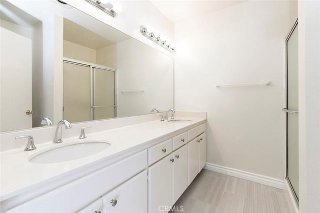 12411 Osborne St Unit 114, Pacoima, CA 91331 - full bathroom with a stall shower and double vanity