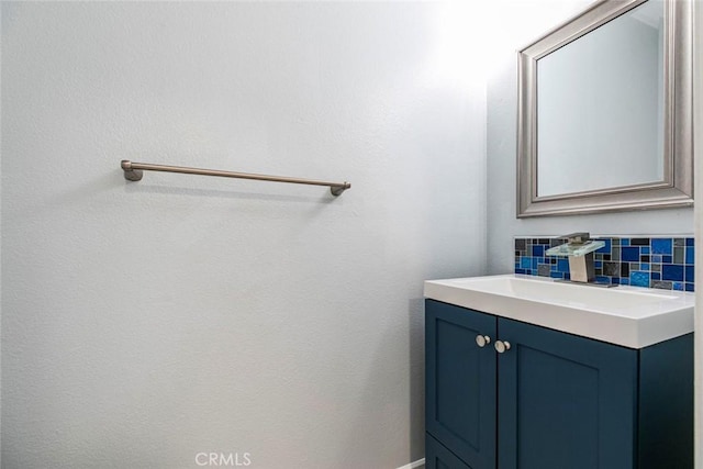 12411 Osborne St Unit 114, Pacoima, CA 91331 - bathroom featuring decorative backsplash and vanity