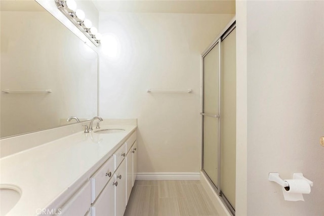 12411 Osborne St Unit 114, Pacoima, CA 91331 - full bathroom featuring double vanity and an enclosed shower