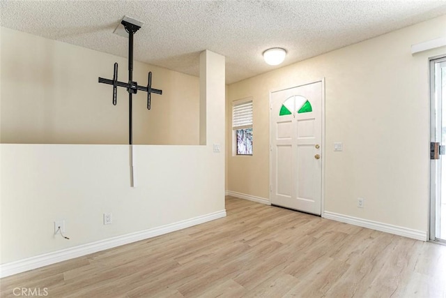 12411 Osborne St Unit 114, Pacoima, CA 91331 - foyer featuring wood finished floors and a textured ceiling