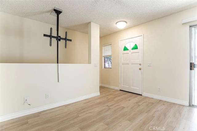 12411 Osborne St Unit 114, Pacoima, CA 91331 - entryway with wood finished floors and a textured ceiling
