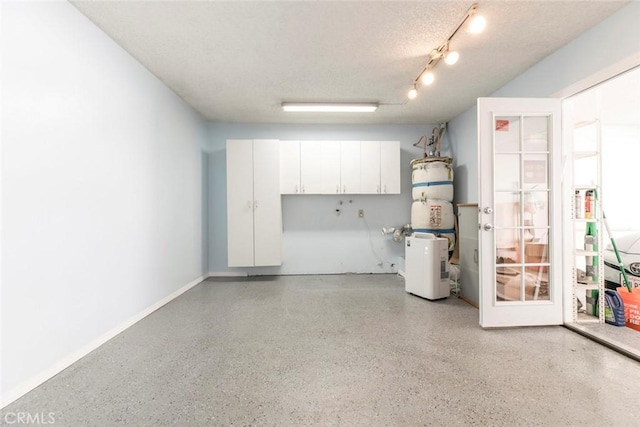 12411 Osborne St Unit 114, Pacoima, CA 91331 - garage with baseboards and a central vacuum unit
