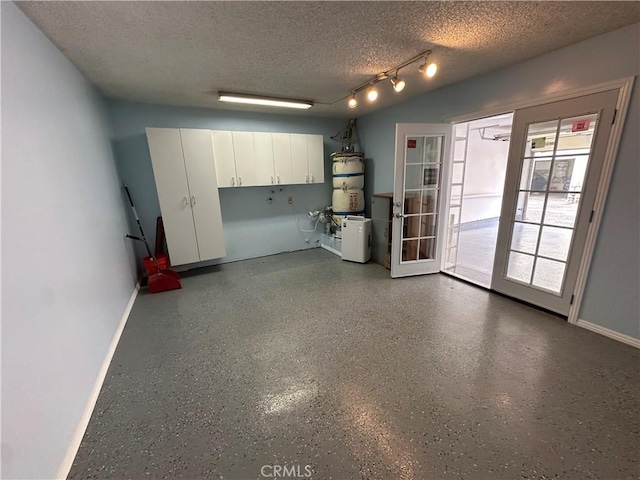 12411 Osborne St Unit 114, Pacoima, CA 91331 - garage featuring water heater and baseboards