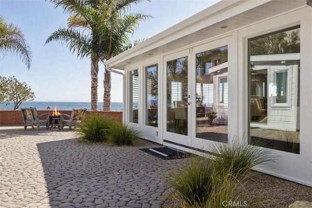 1780 Ocean Blvd, Pismo Beach, CA 93449 - view of patio / terrace with a water view and an outdoor fire pit