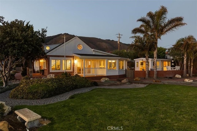 1780 Ocean Blvd, Pismo Beach, CA 93449 - back of property featuring a lawn and a porch