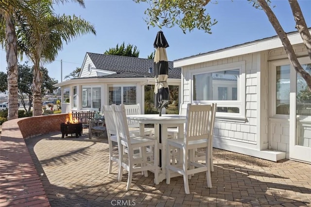 1780 Ocean Blvd, Pismo Beach, CA 93449 - view of patio with a fire pit and outdoor dining space