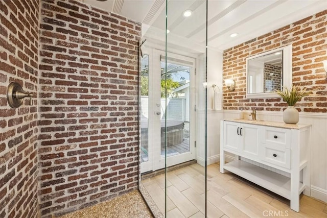 1780 Ocean Blvd, Pismo Beach, CA 93449 - entryway with brick wall, wainscoting, and light wood-style flooring