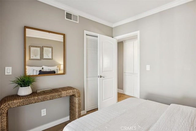 1780 Ocean Blvd, Pismo Beach, CA 93449 - bedroom with crown molding, a closet, and wood finished floors