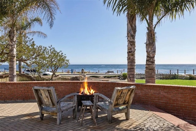 1780 Ocean Blvd, Pismo Beach, CA 93449 - view of patio with a fire pit and a water view