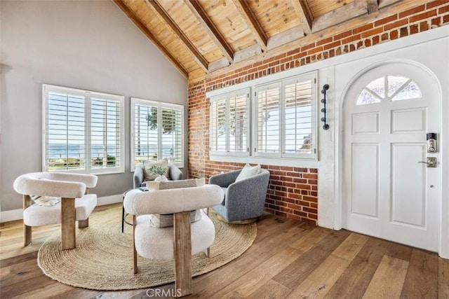 1780 Ocean Blvd, Pismo Beach, CA 93449 - foyer featuring a wooden ceiling with exposed beams, hardwood / wood-style floors, brick wall, and high vaulted ceiling