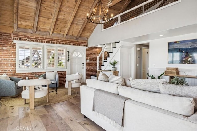 1780 Ocean Blvd, Pismo Beach, CA 93449 - living area featuring a wood ceiling with exposed beams, high vaulted ceiling, stairway, light wood-style floors, and brick wall