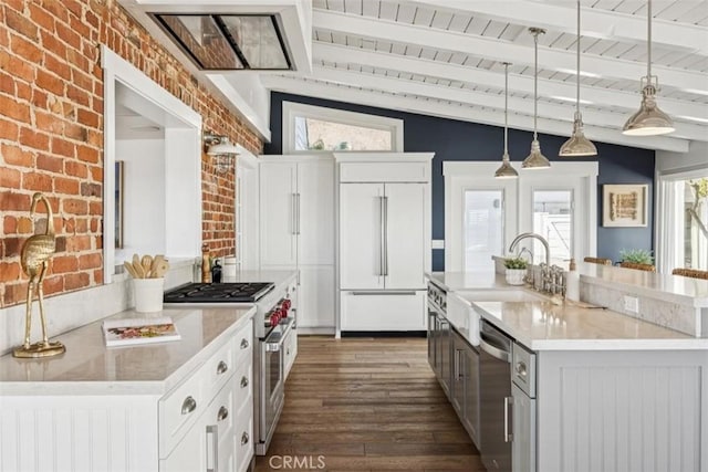 1780 Ocean Blvd, Pismo Beach, CA 93449 - kitchen featuring premium appliances, brick wall, a wooden ceiling with exposed beams, dark wood-type flooring, and white cabinets