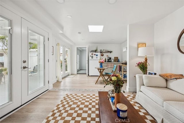 1780 Ocean Blvd, Pismo Beach, CA 93449 - living area with light wood-type flooring and a skylight