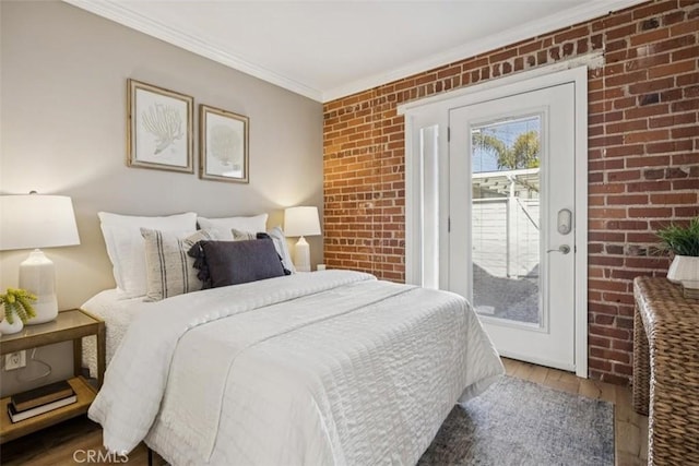 1780 Ocean Blvd, Pismo Beach, CA 93449 - bedroom featuring brick wall, access to outside, wood finished floors, and ornamental molding