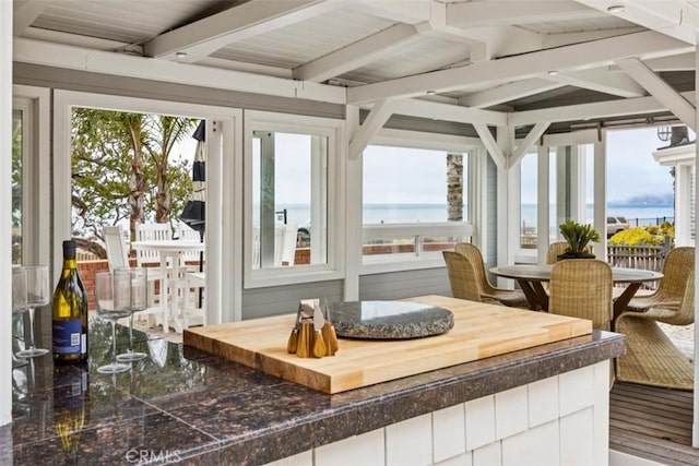 1780 Ocean Blvd, Pismo Beach, CA 93449 - sunroom with plenty of natural light, beamed ceiling, and a water view