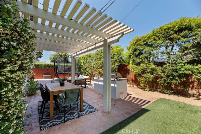 414 Faye Ln, Redondo Beach, CA 90277 - fenced backyard featuring a trampoline, a patio, a pergola, and outdoor dining space