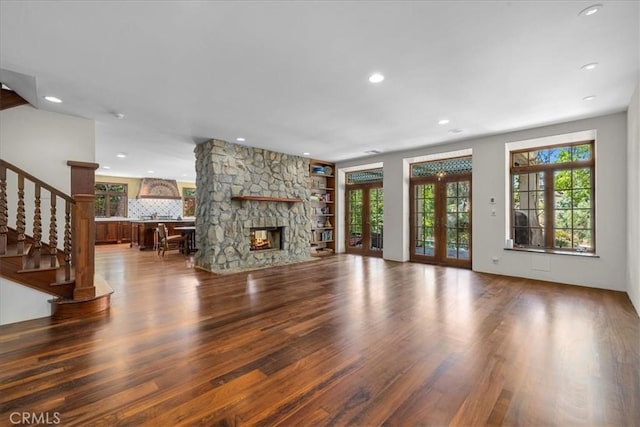 79 Dapplegray Ln, Rolling Hills Estates, CA 90274 - unfurnished living room with wood finished floors, recessed lighting, stairway, and a stone fireplace
