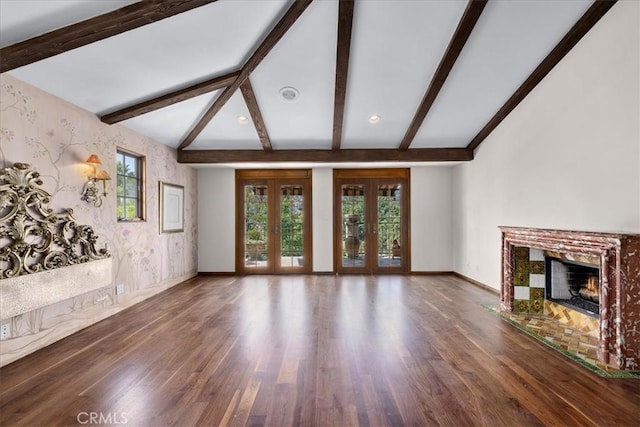 79 Dapplegray Ln, Rolling Hills Estates, CA 90274 - unfurnished living room featuring wallpapered walls, wood finished floors, a premium fireplace, and french doors