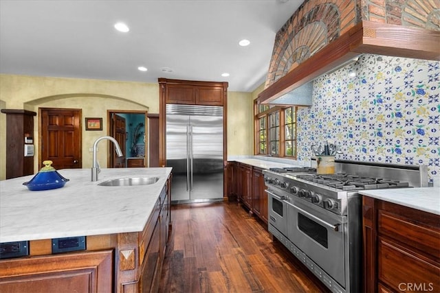 79 Dapplegray Ln, Rolling Hills Estates, CA 90274 - kitchen with high end appliances, dark wood finished floors, a kitchen island with sink, recessed lighting, and wallpapered walls