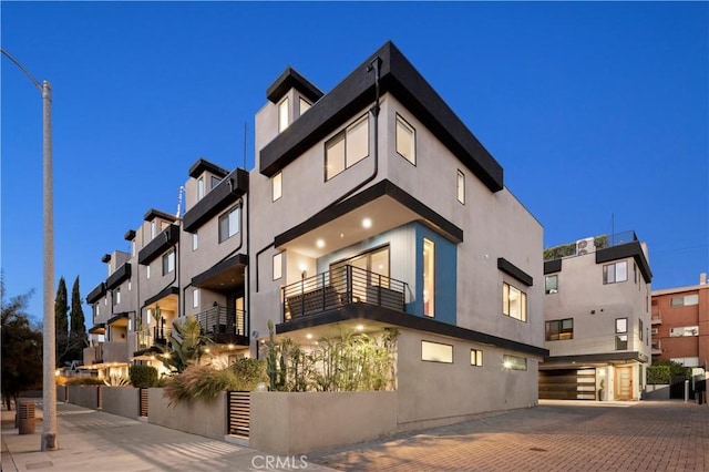 922 N Ridgewood Pl, Los Angeles, CA 90038 - view of building exterior with a garage and decorative driveway