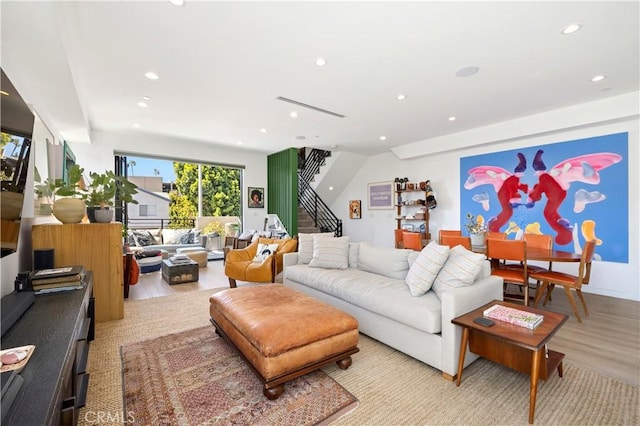 922 N Ridgewood Pl, Los Angeles, CA 90038 - living area with stairway, light wood-style floors, and recessed lighting