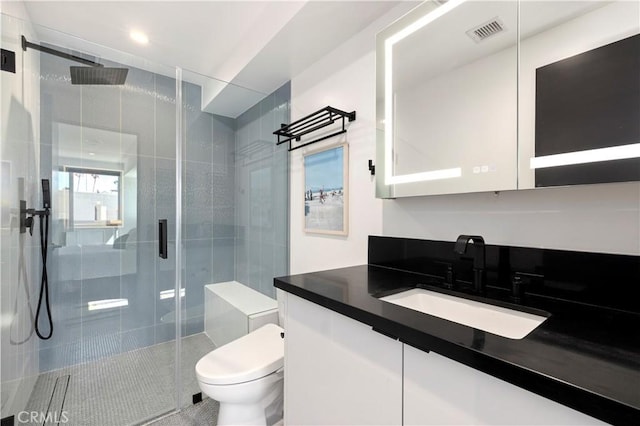 922 N Ridgewood Pl, Los Angeles, CA 90038 - full bathroom with vanity, a stall shower, and tile patterned floors