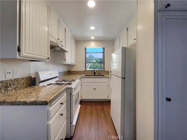 28021 Sarabande Ln Unit 1209, Canyon Country, CA 91387 - kitchen featuring white appliances, dark wood-style floors, white cabinetry, and recessed lighting